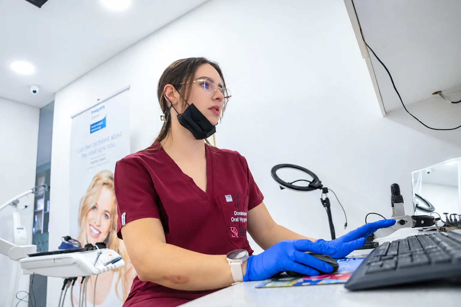 Oral hygienist Dominique Swanepoel at the treatment-room computer