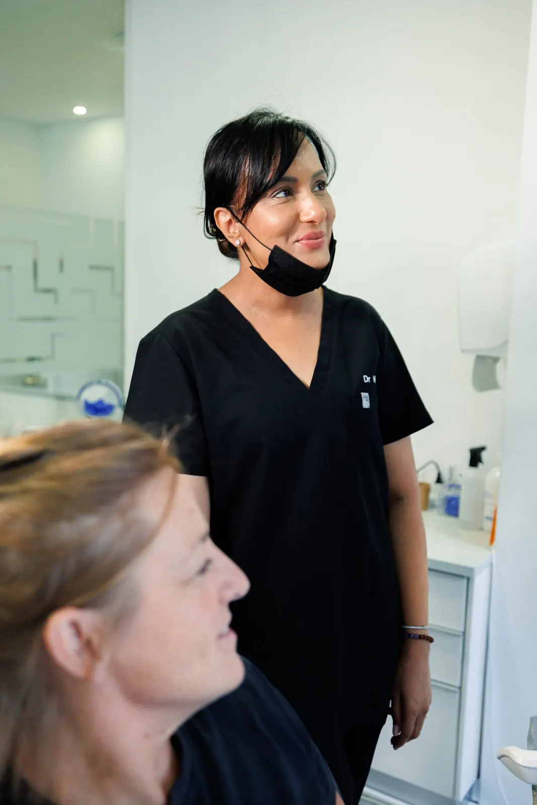 Dentist chatting with a patient before treatment