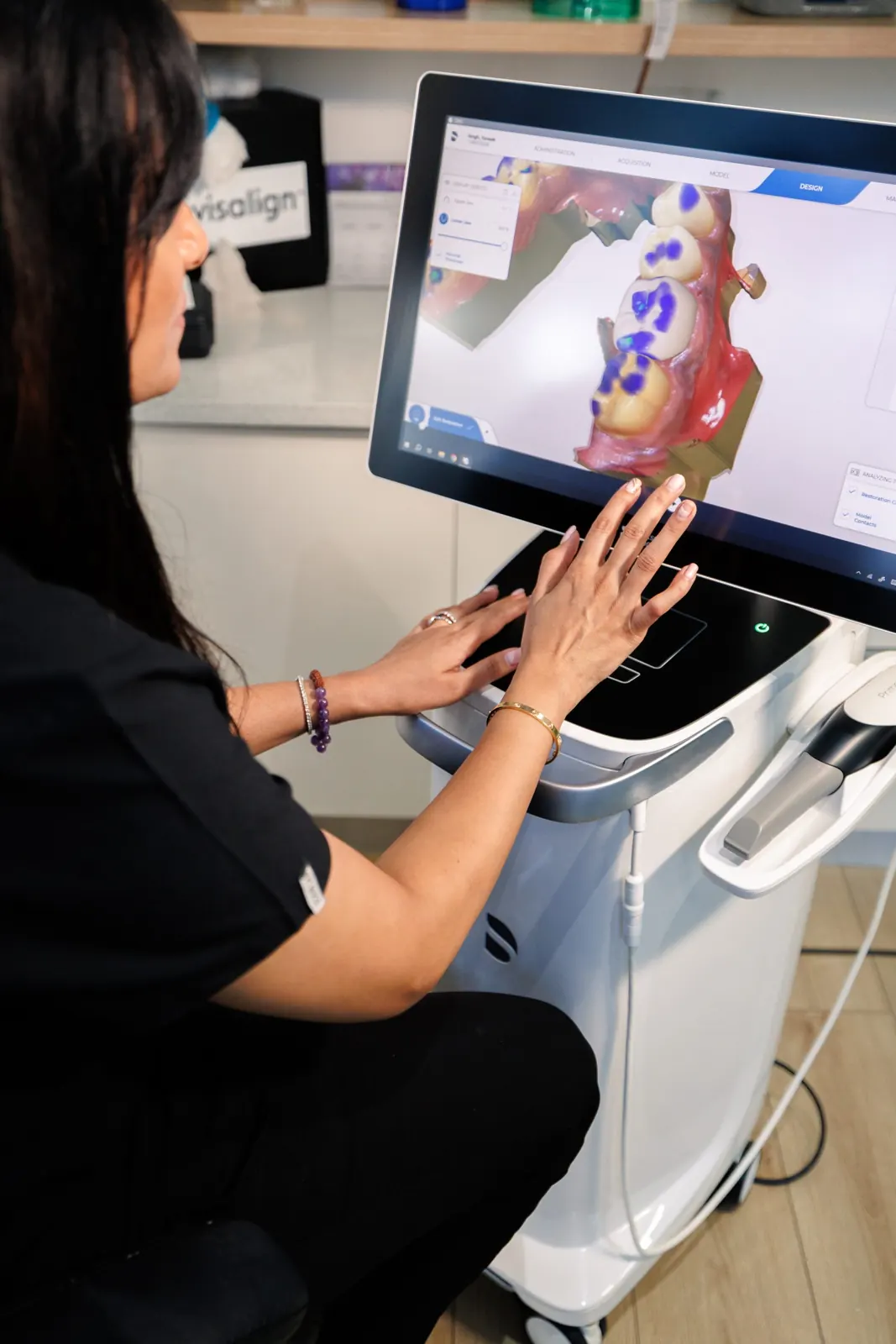 Dentist designing a ceramic restoration on a 3D scan of the teeth