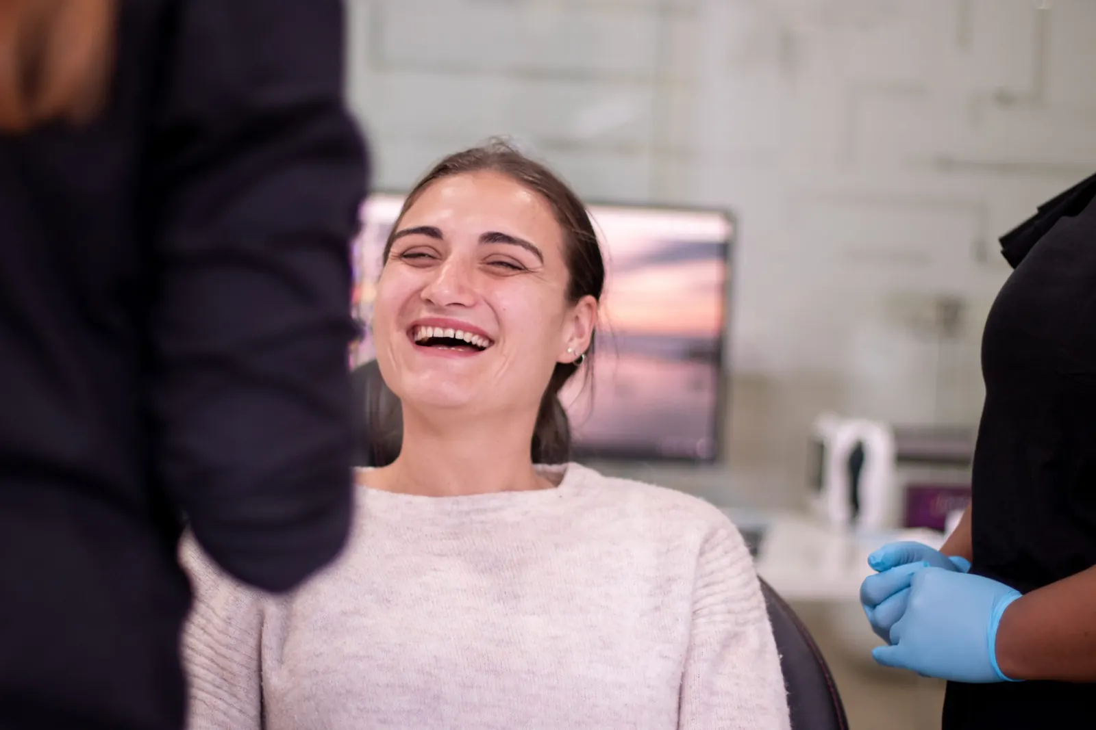 Patient laughing in the treatment chair